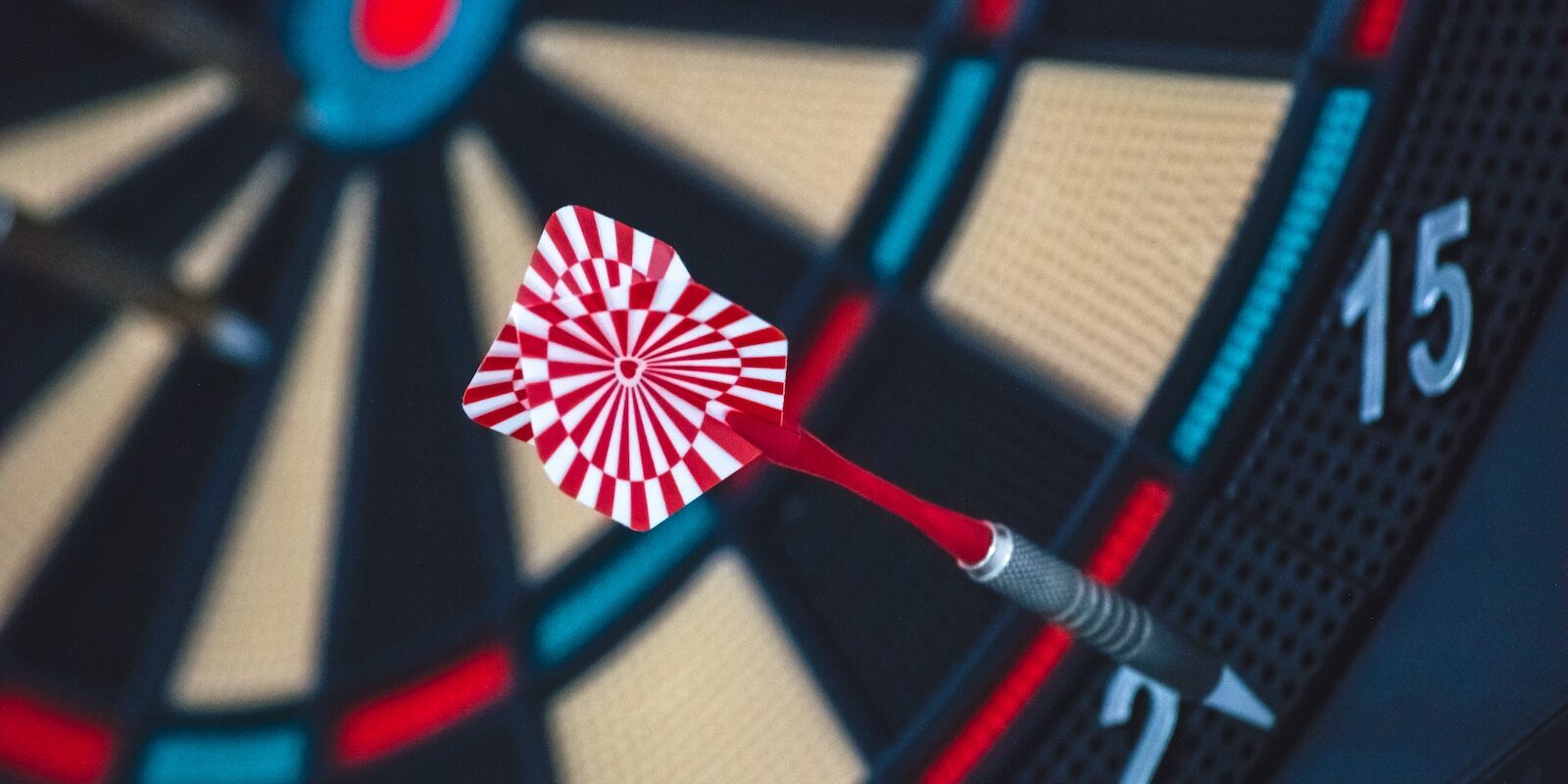 Red and White Dart on Darts Board